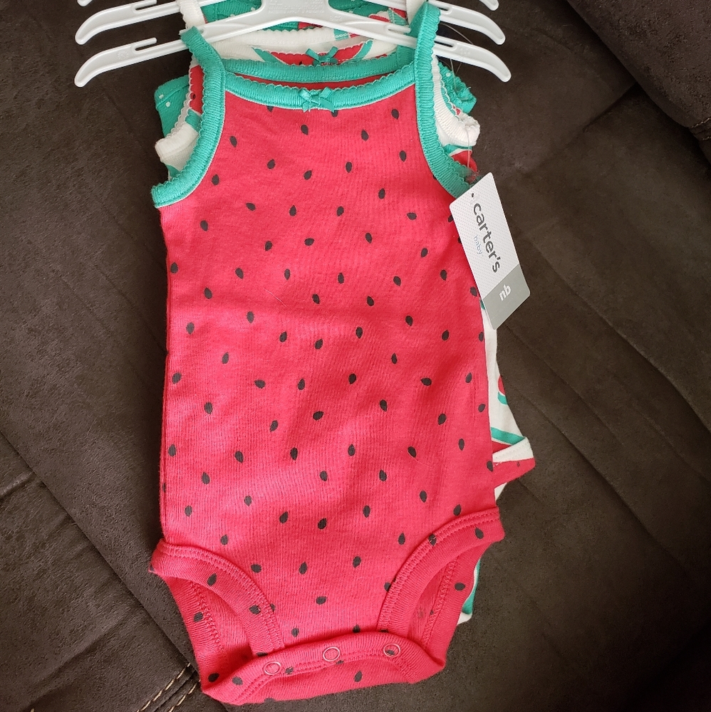Four pack Carters newborn tank tops
